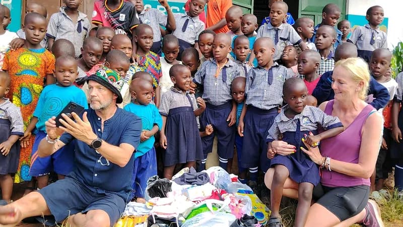 Visitors and children gathered at His Grace Junior School in Masaka